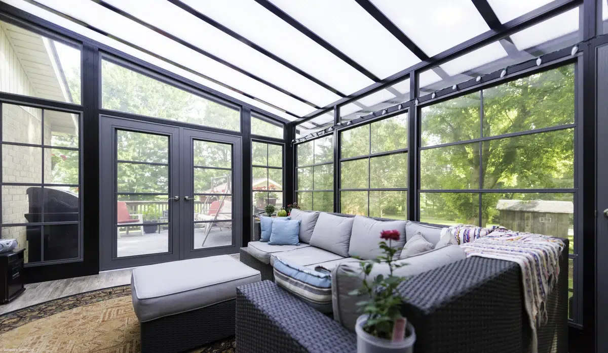 3-Season Sunroom Vinyl Model 200 with black-framed glass walls and a transparent roof.